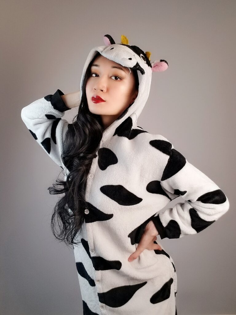 Xiran Jay Zhao author photo in a cow suit